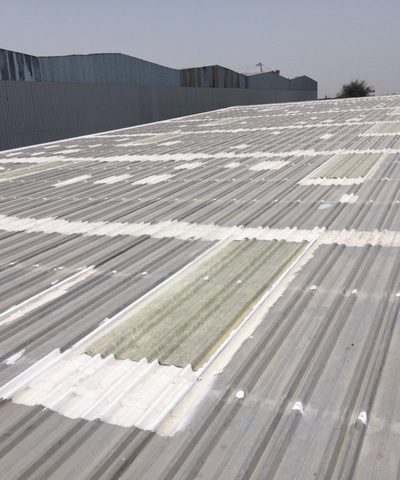 Existing corrugated roof with repaired overlaps and penetrations